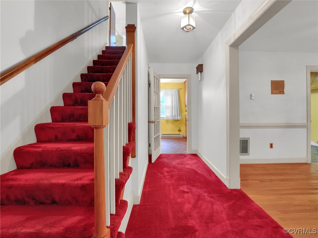 8901 Strath Road Henrico, VA 23231 - Photo 17 of 47 Stairs with hardwood / wood-style flooring and a b
