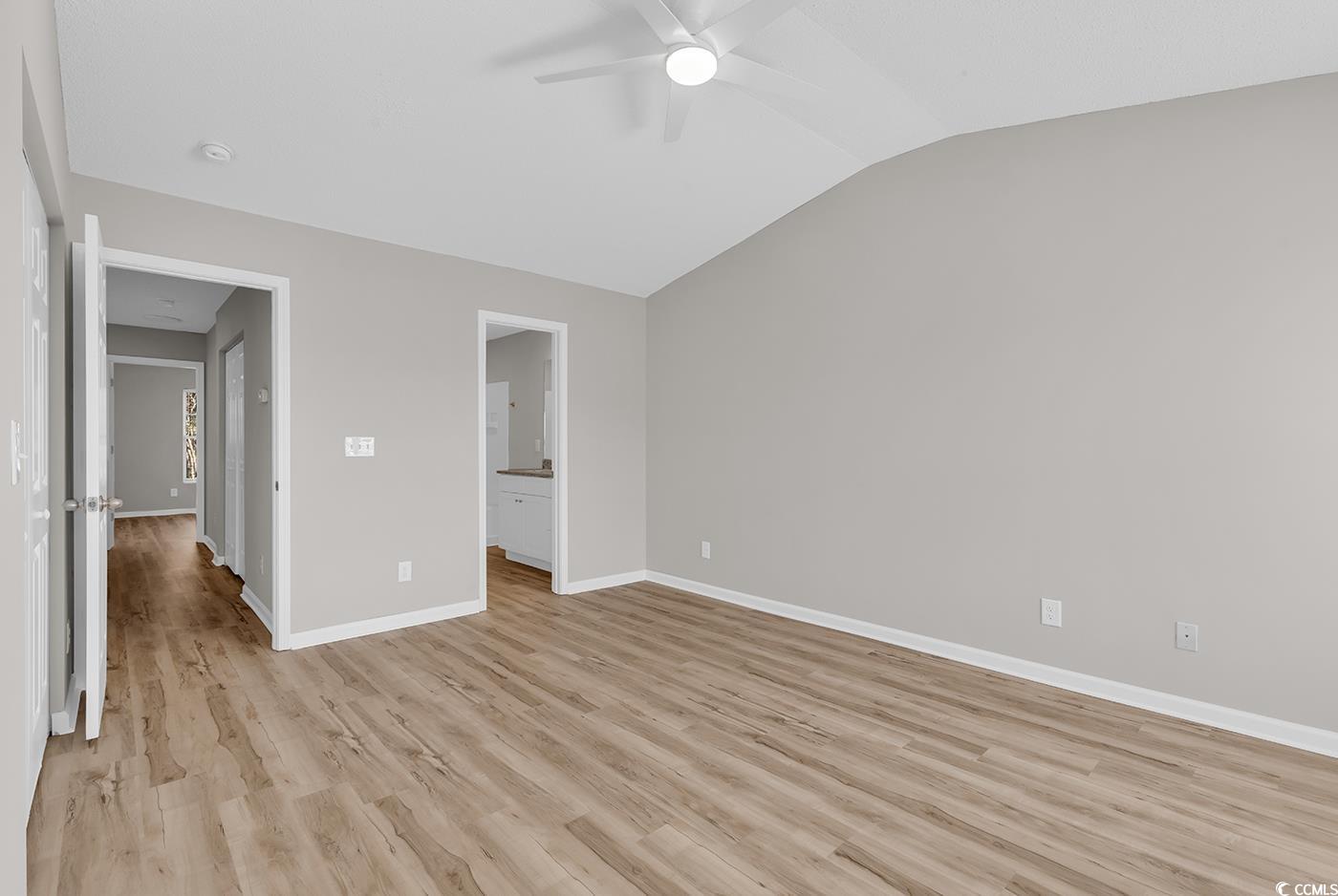 308 Kiskadee Loop, Unit E Conway, SC 29526 - Photo 18 of 36 Unfurnished bedroom featuring connected bathroom, lofted ceiling, light wood-style floors, and ceiling fan