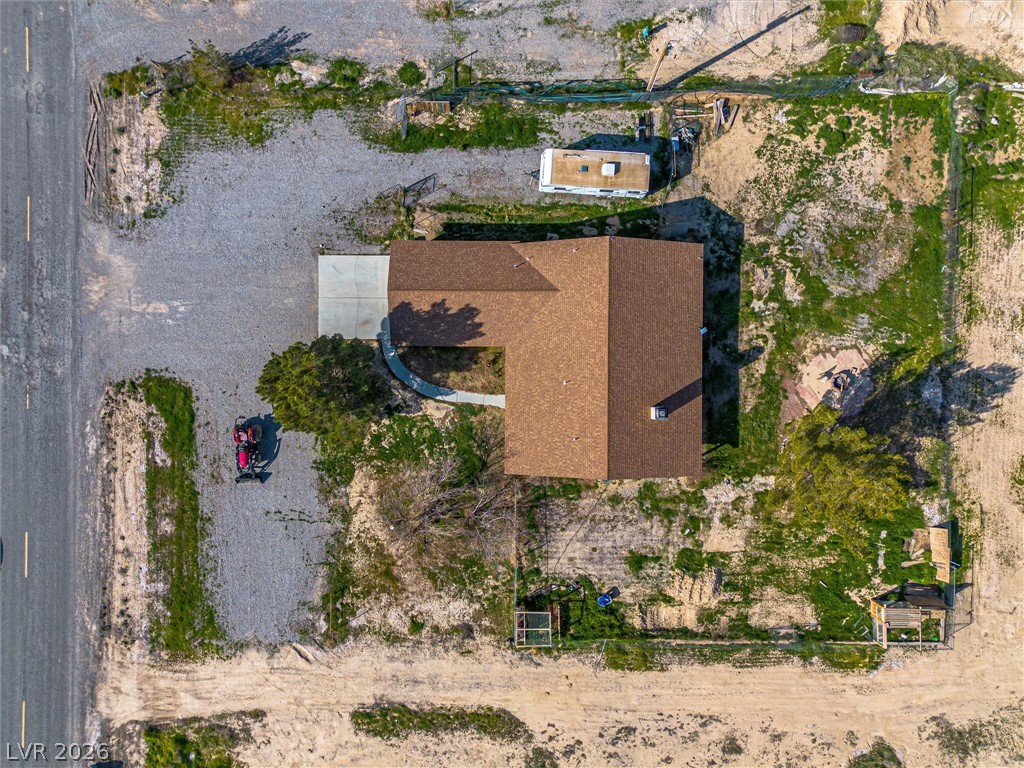 2780 West Simkins Road Pahrump, NV 89060 - Photo 39 of 40 An aerial perspective reveals a private residence nestled on a spacious, verdant lot.