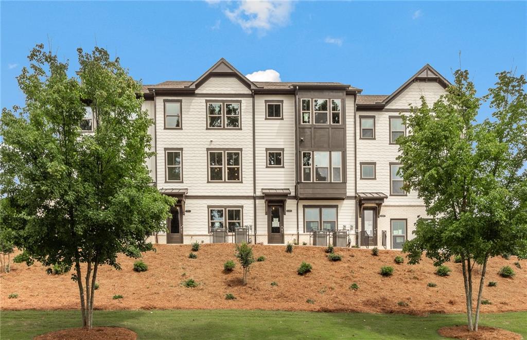 1080 Patterson Park Road Decatur, GA 30033 - Photo 1 of 1 a front view of a residential apartment building with a yard