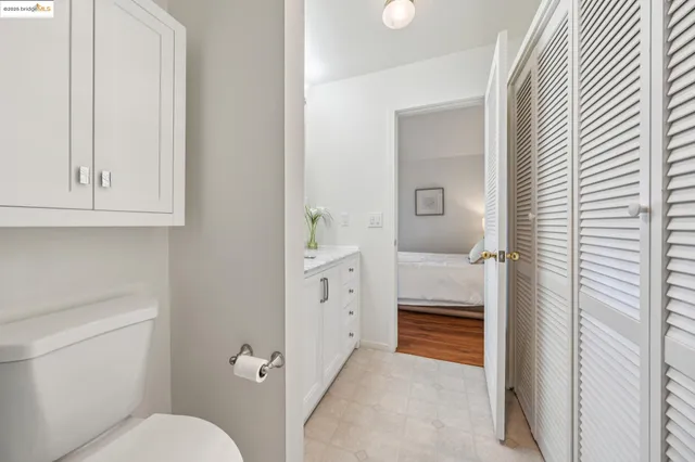 a white toilet sitting next to a bath tub shower