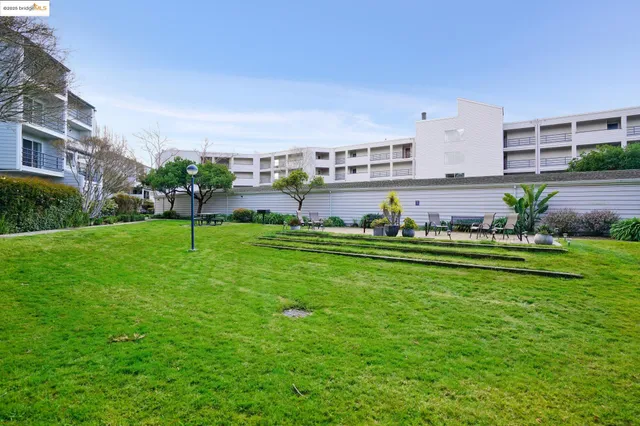 a view of a house with swimming pool garden and outdoor seating