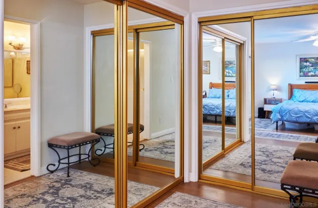 a view of a livingroom with furniture and entryway