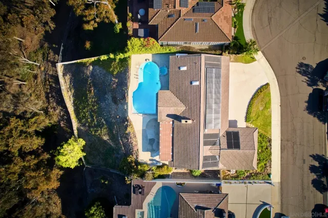 a aerial view of a house with a swimming pool
