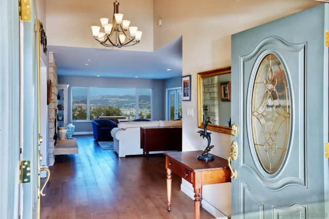 a living room with furniture a window and a fireplace