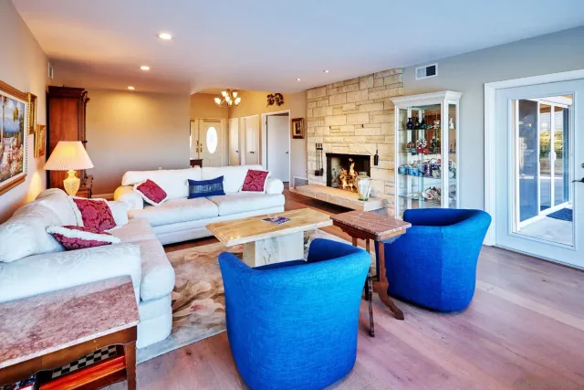 a living room with furniture and wooden floor
