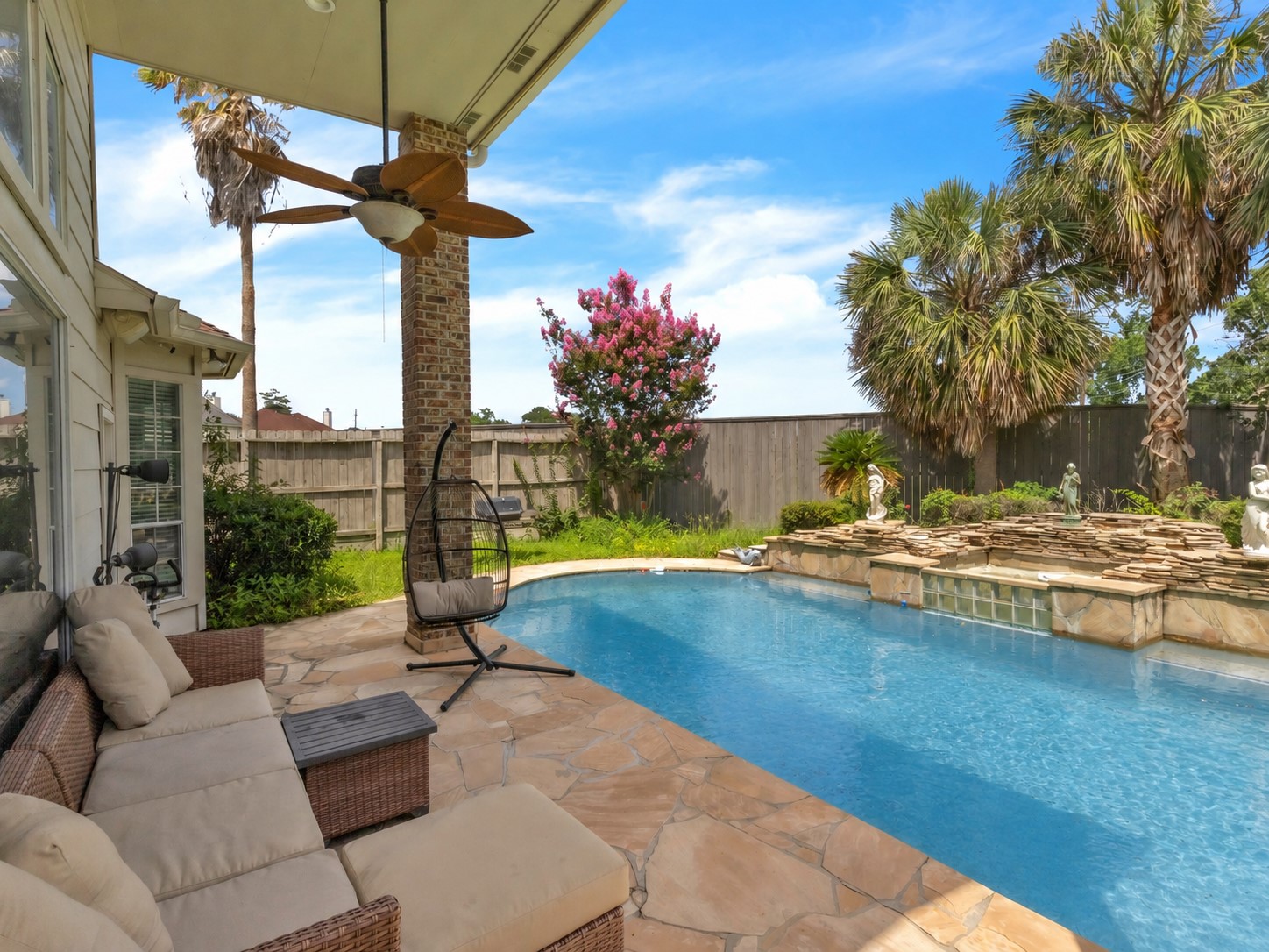 17902 St Emilion Court Spring, TX 77379 - Photo 35 of 38 Backyard with pool inground (pool water color have been edited by AI)