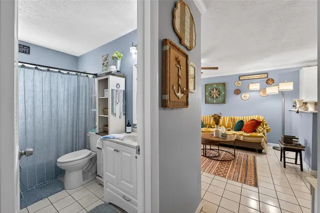 a bathroom with a sink vanity and mirror