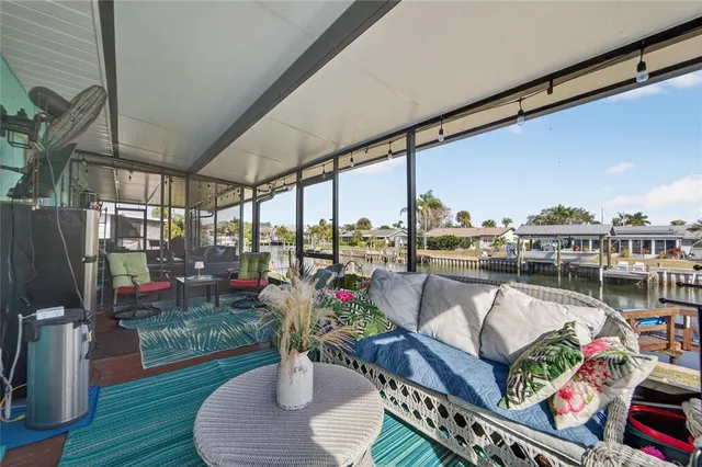 a view of a swimming pool with seating area