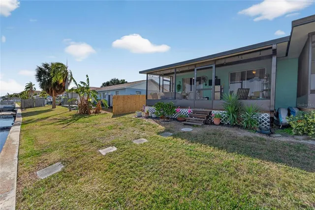 a view of a lake with boats and trees