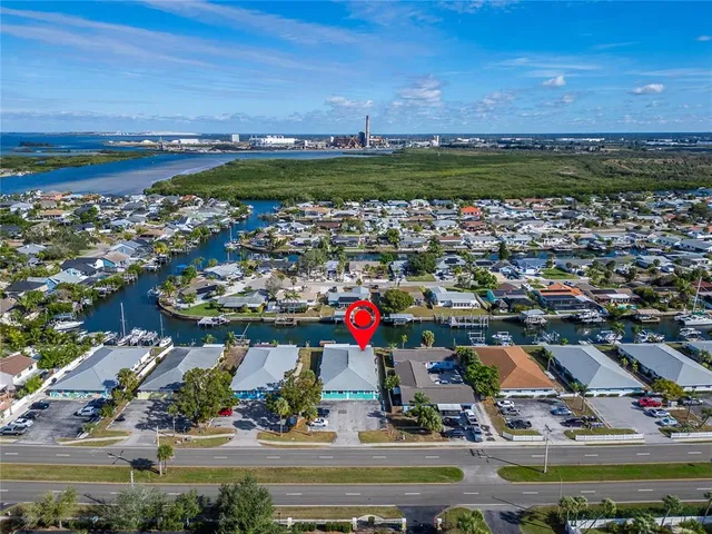 an aerial view of a house with a ocean view