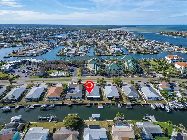 a swimming pool with outdoor seating and yard