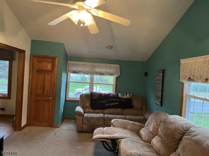 20 Nottingham Drive Howell, NJ 07731 - Photo 5 of 21 a living room with furniture a window and a chandelier