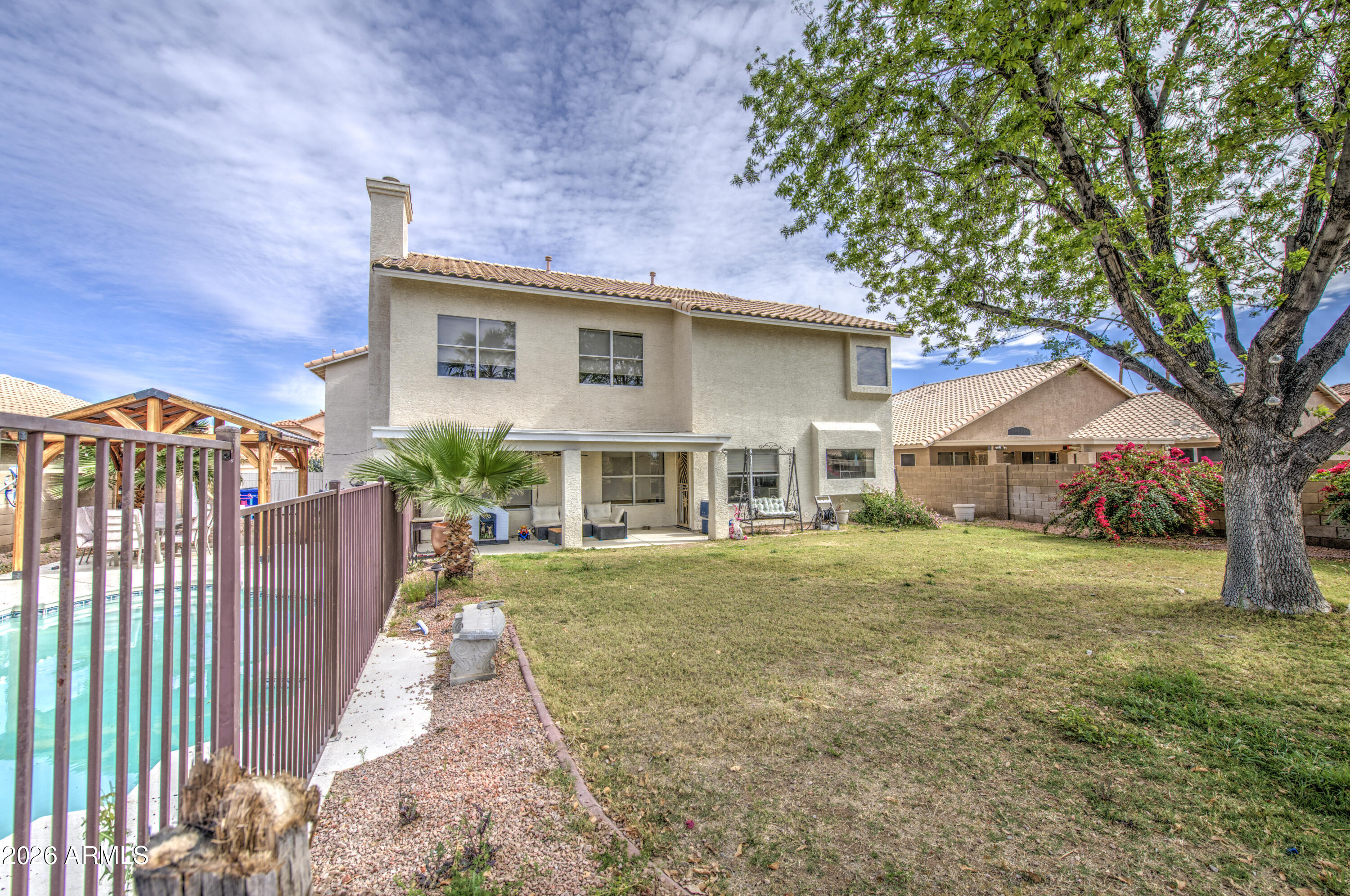 12403 West Monte Vista Road Avondale, AZ 85392 - Photo 57 of 63 a front view of house with yard and green space