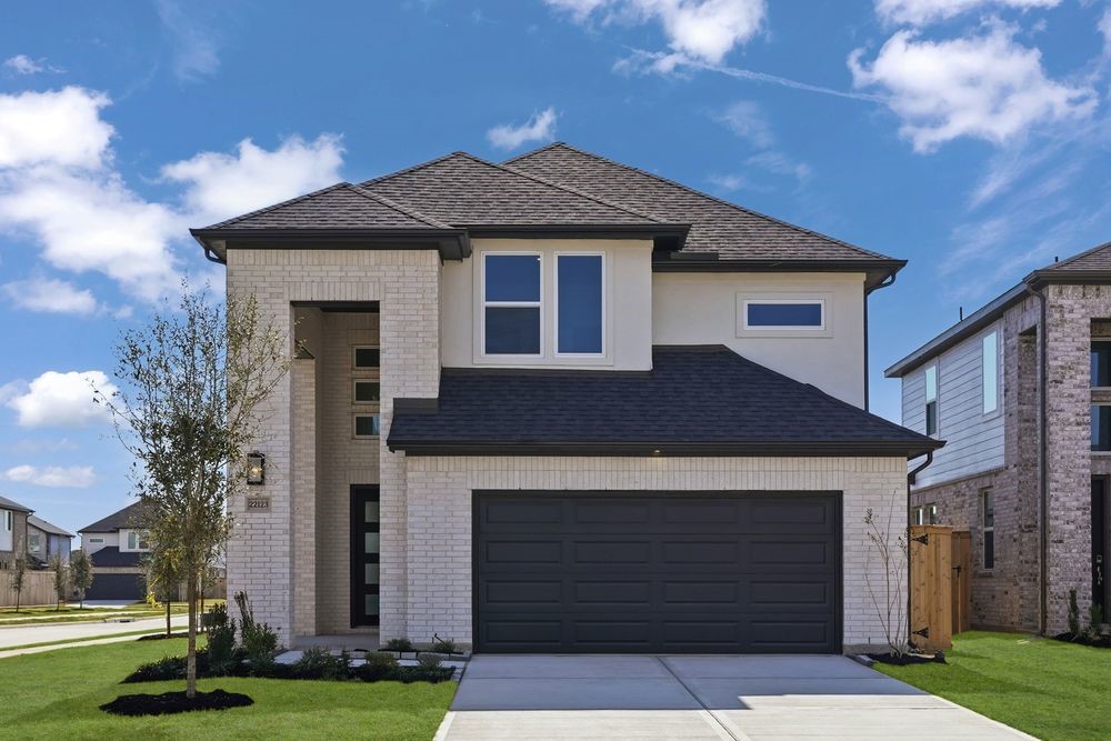 22123 Rangemore Drive Cypress, TX 77433 - Photo 1 of 34 a front view of a house with a yard