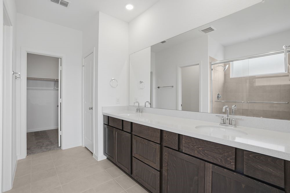 22123 Rangemore Drive Cypress, TX 77433 - Photo 14 of 34 a bathroom with a sink double vanity and a mirror