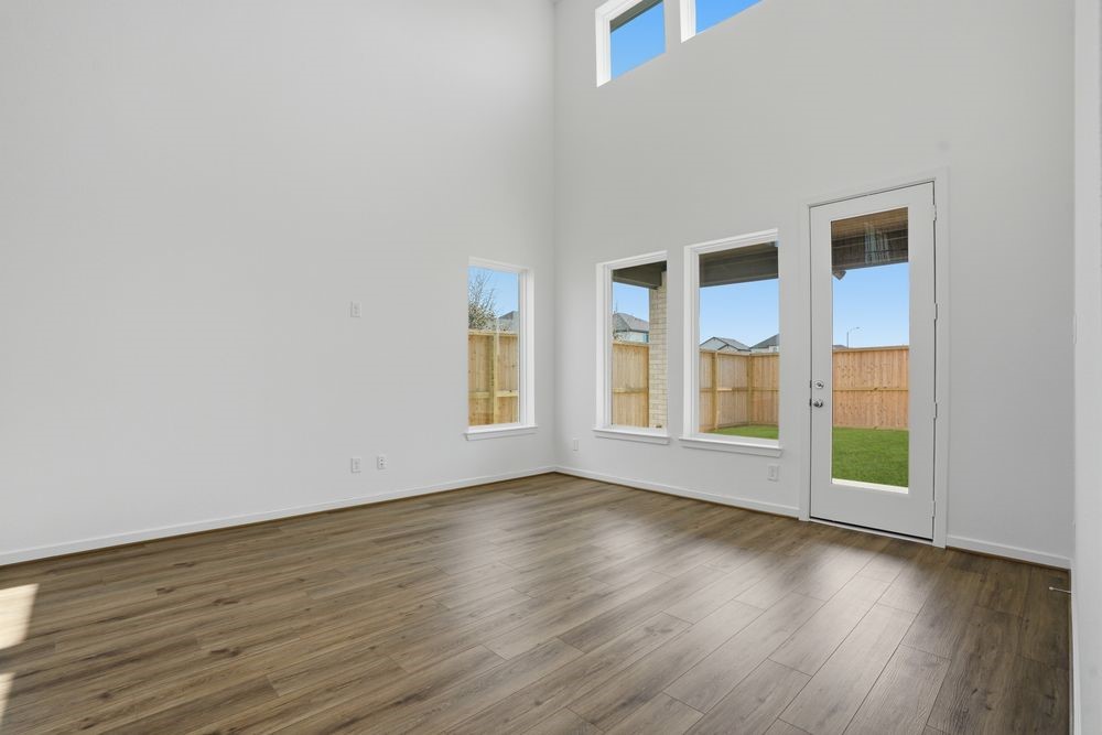 22123 Rangemore Drive Cypress, TX 77433 - Photo 5 of 34 a view of an empty room with wooden floor and a window