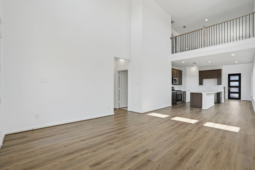 22123 Rangemore Drive Cypress, TX 77433 - Photo 8 of 34 a view of a kitchen with a microwave and a stove