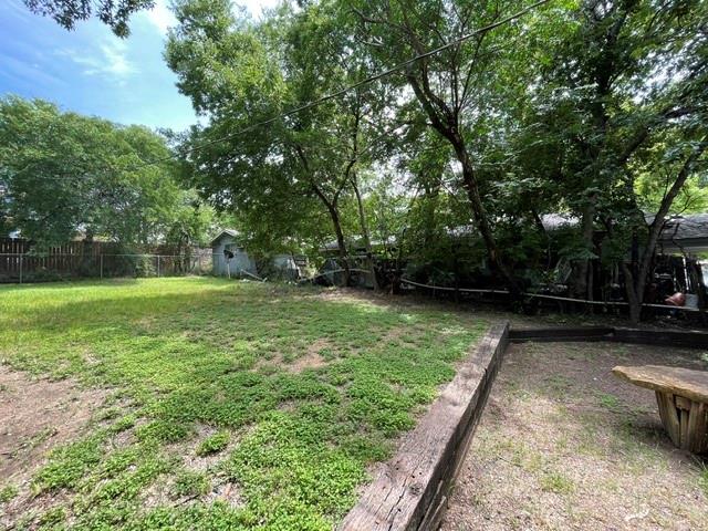 845 Rumfield Road White Settlement, TX 76108 - Photo 17 of 19 a view of a backyard with a trees
