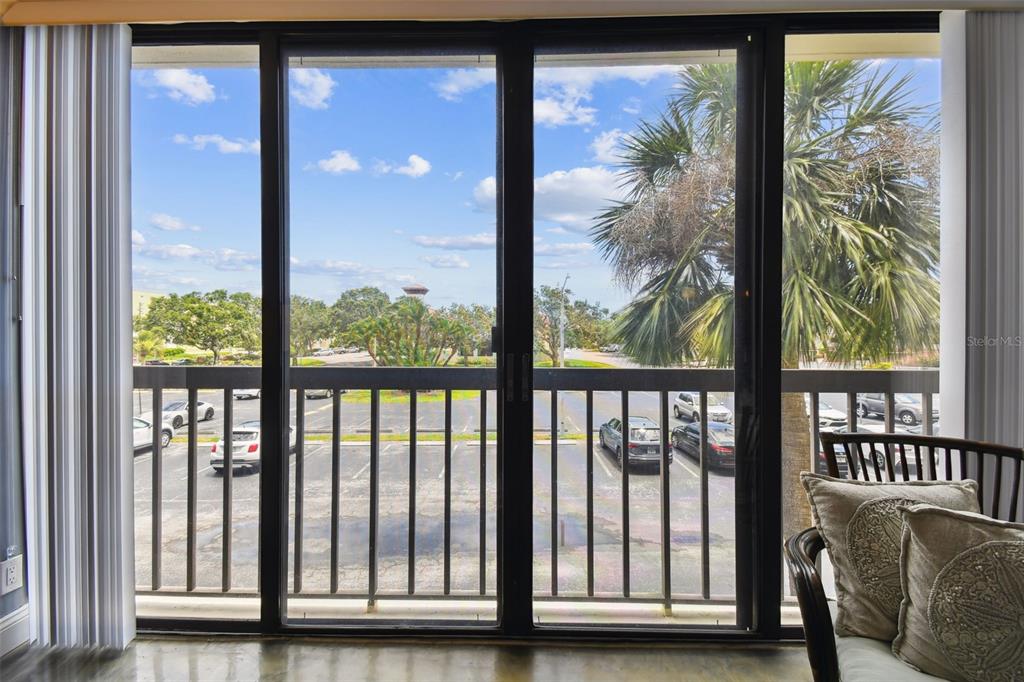 255 Dolphin Point, Unit 207 Clearwater Beach, FL 33767 - Photo 22 of 69 a view of a porch with a large window