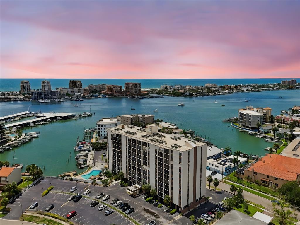 255 Dolphin Point, Unit 207 Clearwater Beach, FL 33767 - Photo 68 of 69 a view of a lake with a mountain view