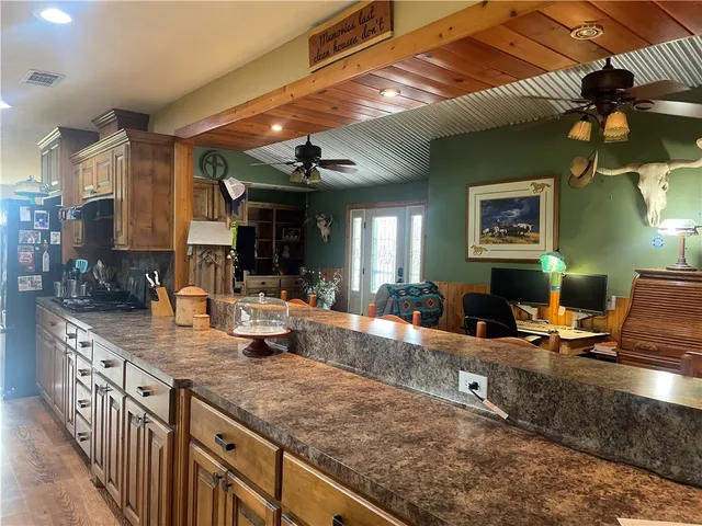 a kitchen with sink stove and cabinets