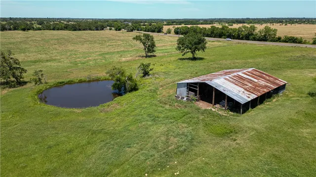 a view of a lake with a yard