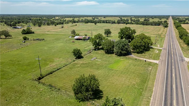a view of a lake with a yard