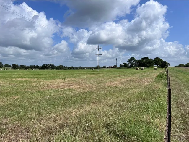 a view of a golf course with a big yard