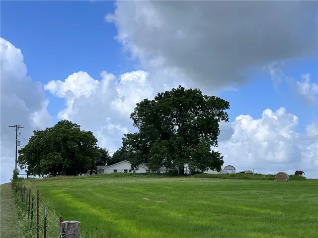 a backyard of a house with lots of green space