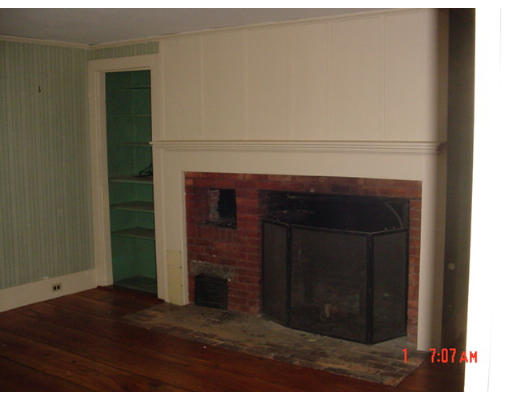 48 Old Mill Road Harvard, MA 01451 - Photo 3 of 8 a living room with a fireplace