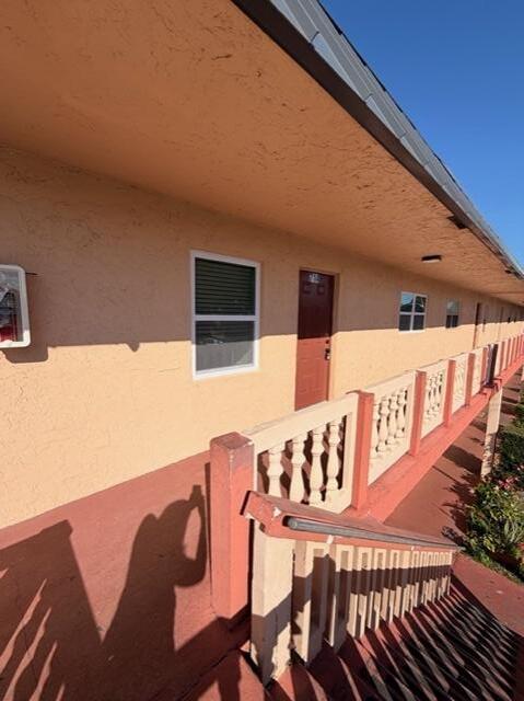 9374 Southwest 3rd Street, Unit 714 Boca Raton, FL 33428 - Photo 19 of 21 a view of a patio with table and chairs