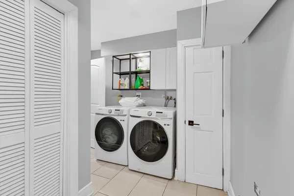 a utility room with dryer and washer