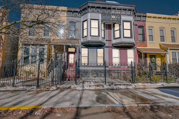 a front view of a building and a street