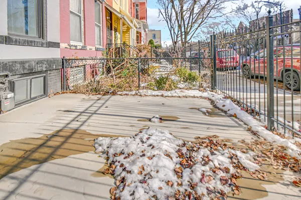 a view of a pathway with a building in the background
