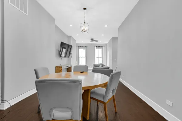 a view of a dining room with furniture and window