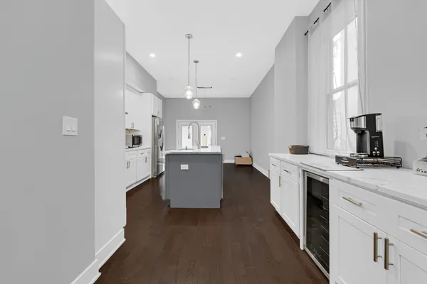 a kitchen with cabinets and window