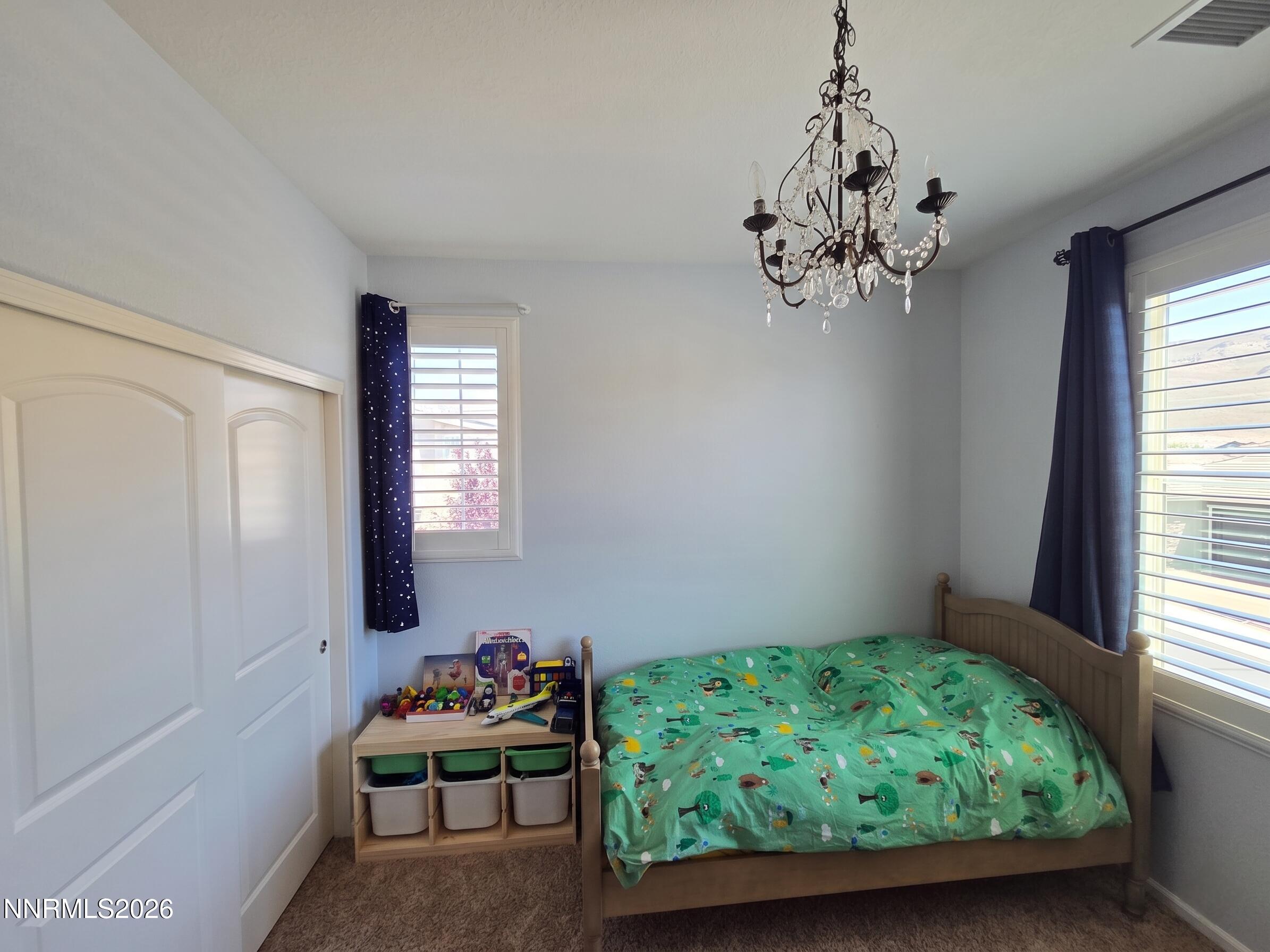 2775 Bonfire Lane Reno, NV 89521 - Photo 28 of 41 a bedroom with bed and a window