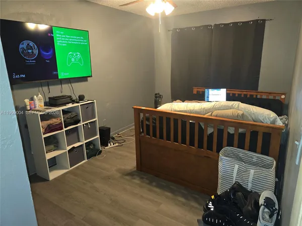 a bedroom with furniture and a window