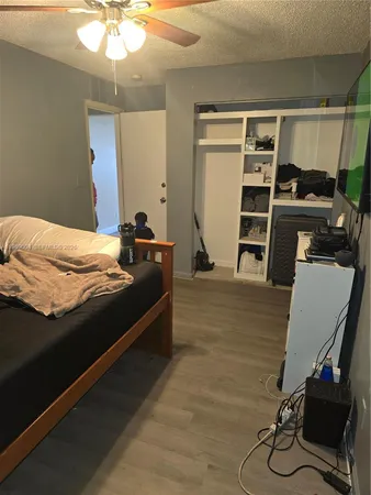 a bedroom with a bed and walk in closet