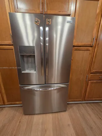 an empty room with wooden floor