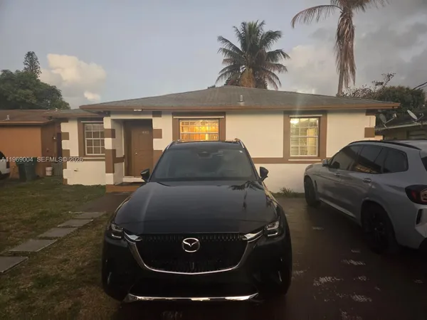 a car parked in front of garage