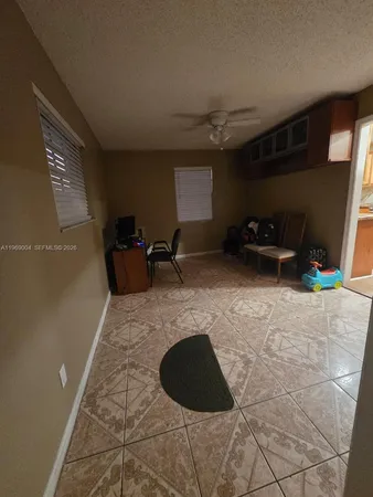 a room with wooden floor and furniture