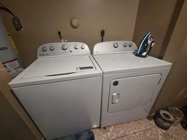 a utility room with dryer and washer