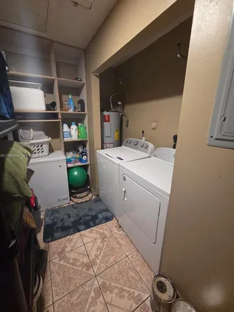 a utility room with dryer and washer