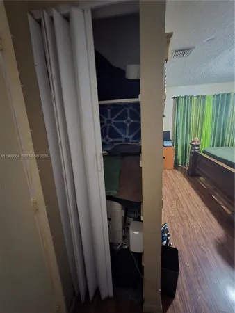 a room with a chair and a window