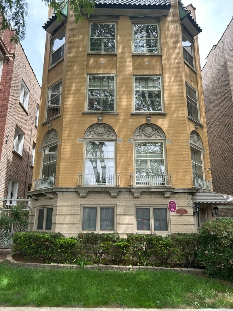 723 Dobson Street, Unit 1 Evanston, IL 60202 - Photo 1 of 1 a front view of a multi story residential apartment building