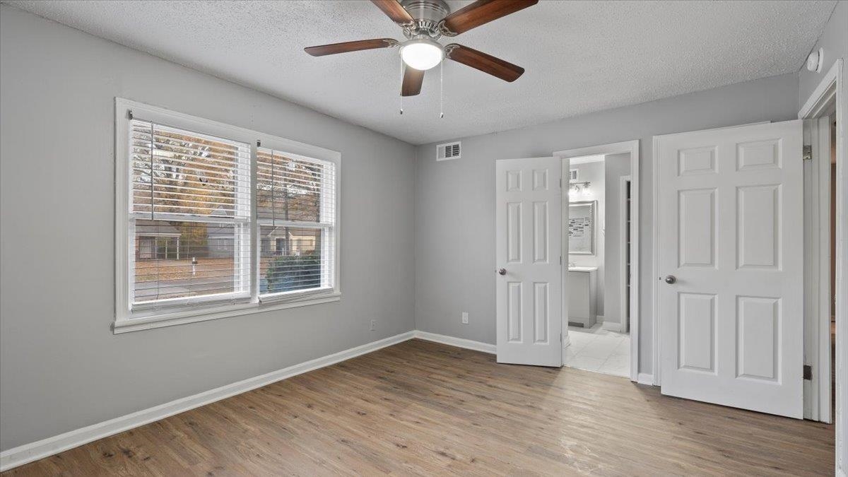 3817 Cazassa Road Memphis, TN 38116 - Photo 11 of 22 a view of empty room with wooden floor and fan