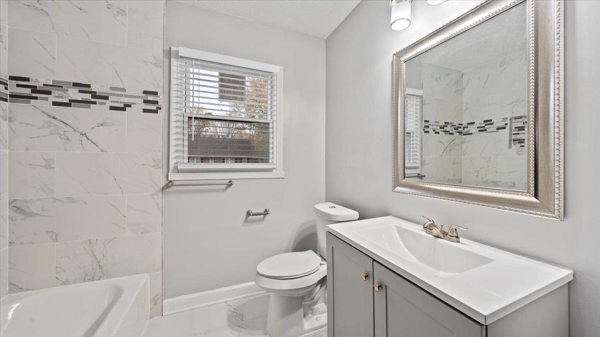 3817 Cazassa Road Memphis, TN 38116 - Photo 12 of 22 a bathroom with a sink a toilet and shower