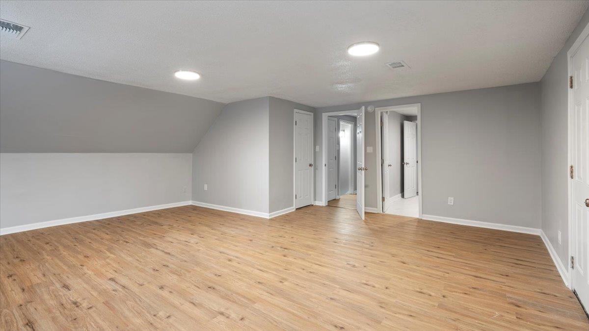 3817 Cazassa Road Memphis, TN 38116 - Photo 14 of 22 a view of an empty room with wooden floor